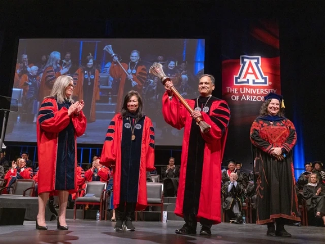 The U of A celebrated the installation of 23rd President Suresh Garimella on March 25. From left: Arizona Gov. Katie Hobbs, Arizona Board of Regents Chair Cecilia Mata, President Garimella holding the university's ceremonial mace, and Chair of the U of A Faculty Leila Hudson. 