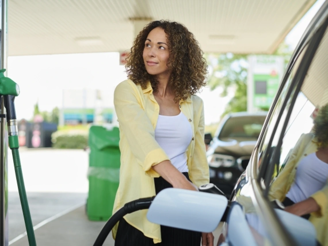 Woman filling up at the pump